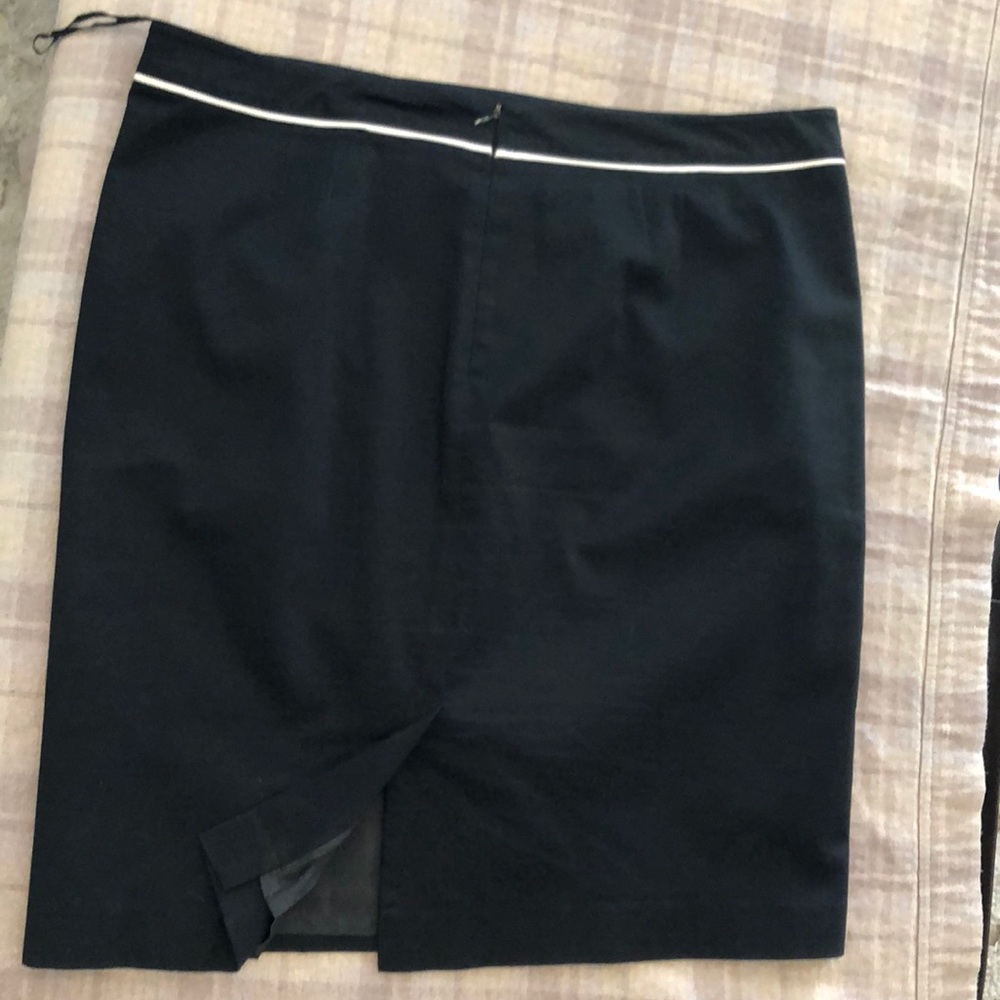 Black skirt with flattering detailing.